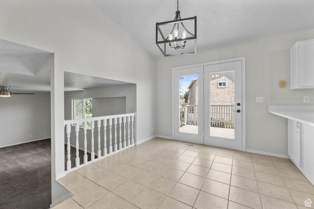 77 W 525 N, Layton, UT 84041 - unfurnished dining area with a chandelier, light tile patterned floors, lofted ceiling, and ceiling fan