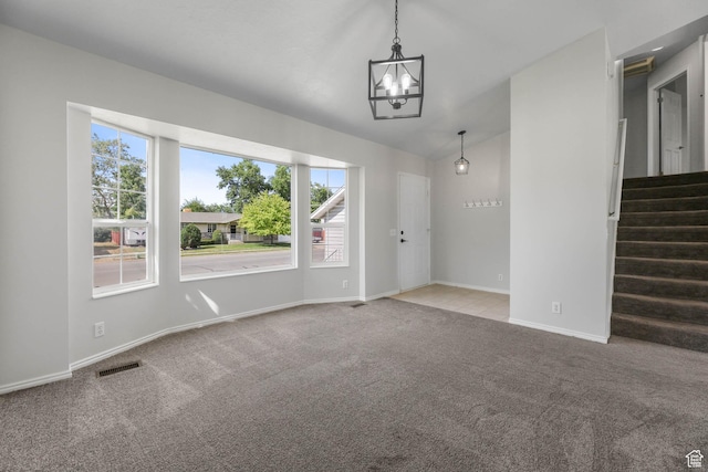 77 W 525 N, Layton, UT 84041 - unfurnished living room with a chandelier, carpet, vaulted ceiling, and stairway