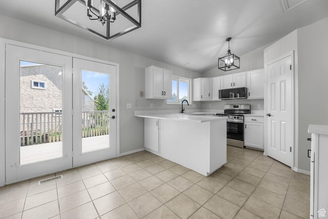 77 W 525 N, Layton, UT 84041 - kitchen featuring a chandelier, stainless steel range with electric cooktop, black microwave, a peninsula, and light countertops