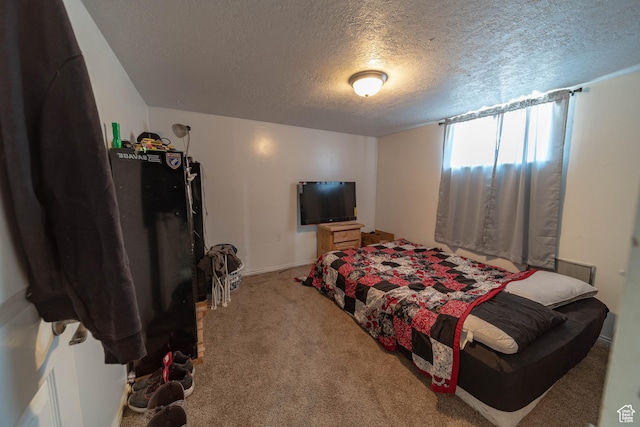 988 N Smith Dr, Price, UT 84501 - carpeted bedroom featuring a textured ceiling and baseboards