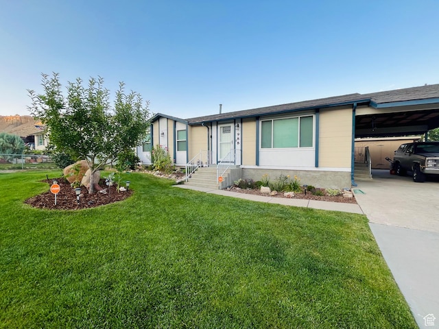 988 N Smith Dr, Price, UT 84501 - view of front of property featuring an attached carport, a front yard, and driveway
