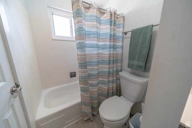 988 N Smith Dr, Price, UT 84501 - full bathroom featuring toilet and shower / bath combo with shower curtain