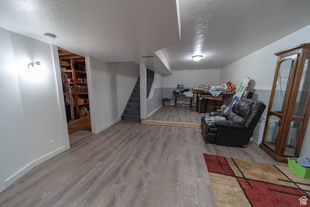 988 N Smith Dr, Price, UT 84501 - finished below grade area with wood finished floors, stairs, and a textured ceiling