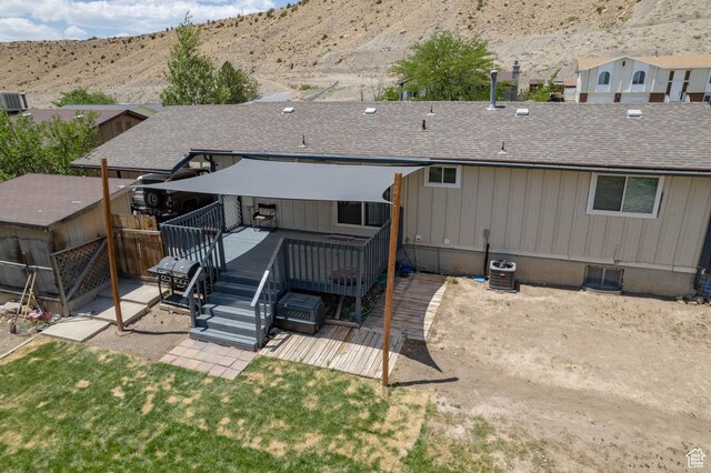 988 N Smith Dr, Price, UT 84501 - rear view of house with a deck with mountain view and roof with shingles