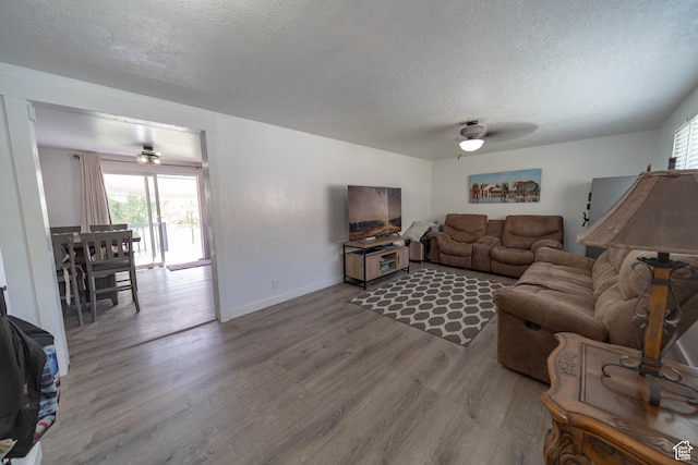 988 N Smith Dr, Price, UT 84501 - living area featuring a ceiling fan, wood finished floors, and a textured ceiling