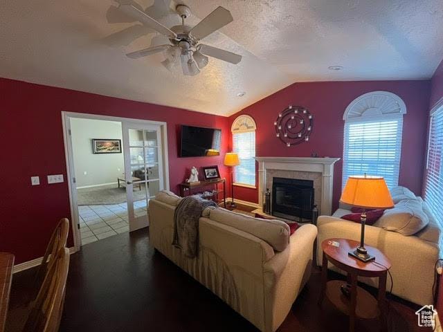 2254 N 390 E, Provo, UT 84604 - living area featuring lofted ceiling, a ceiling fan, a tiled fireplace, and a textured ceiling