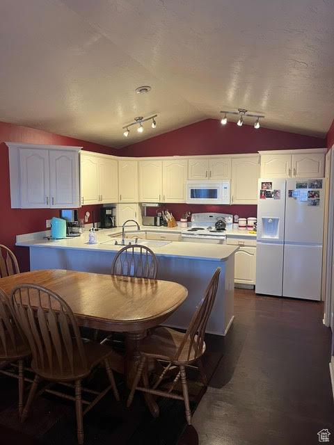 2254 N 390 E, Provo, UT 84604 - kitchen with white appliances, vaulted ceiling, white cabinetry, light countertops, and a peninsula