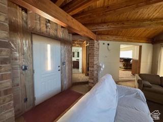 9 Red Cir, Manila, UT 84046 - living room with a fireplace and a wood ceiling with exposed beams