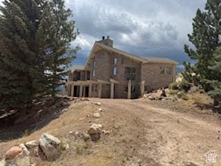 9 Red Cir, Manila, UT 84046 - rear view of property with a chimney