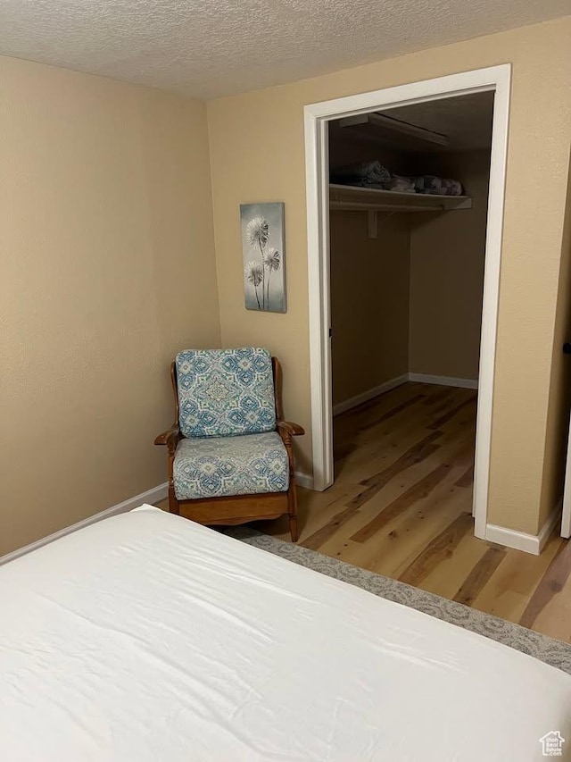 240 N 1400 W, Cedar City, UT 84721 - bedroom featuring light wood-style floors, a closet, and a textured ceiling