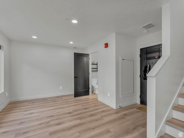 351 W 800 N # 9, Salt Lake City, UT 84103 - below grade area featuring light wood-style flooring, stairs, and recessed lighting
