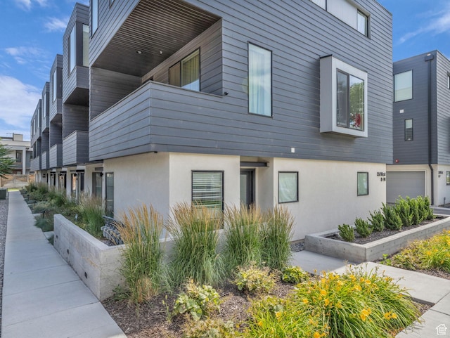 351 W 800 N # 9, Salt Lake City, UT 84103 - view of side of property featuring stucco siding and a balcony