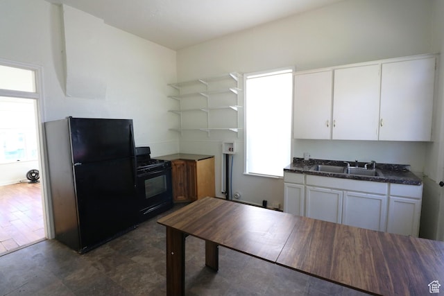 262 E 33rd St S, Ogden, UT 84401 - kitchen featuring black appliances, dark countertops, plenty of natural light, and white cabinetry