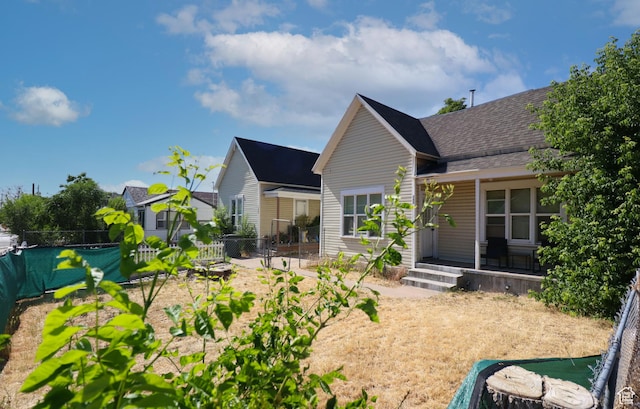 262 E 33rd St S, Ogden, UT 84401 - rear view of house with roof with shingles and covered porch