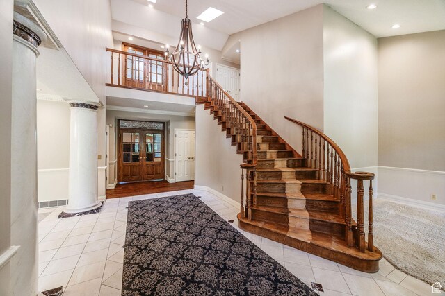 1387 E 260 N, Logan, UT 84321 - tiled entrance foyer with a chandelier, stairs, recessed lighting, a high ceiling, and ornate columns