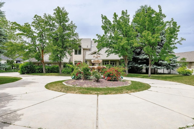 1387 E 260 N, Logan, UT 84321 - obstructed view of property with curved driveway, a tile roof, and a front yard