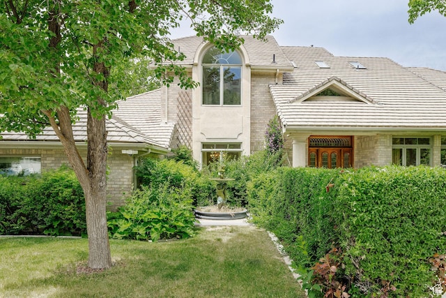 1387 E 260 N, Logan, UT 84321 - view of front of house with a tile roof and a front lawn