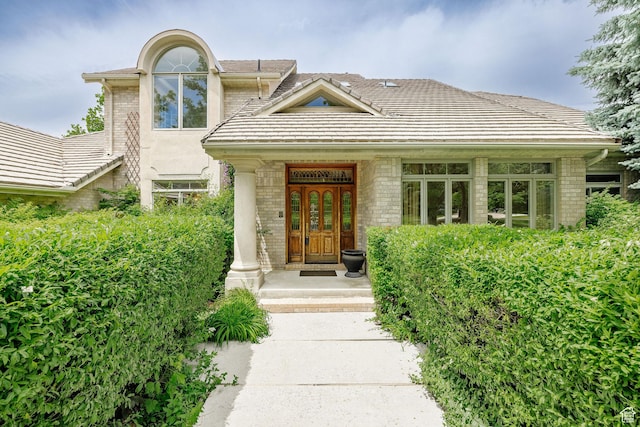 1387 E 260 N, Logan, UT 84321 - property entrance with a tile roof and brick siding