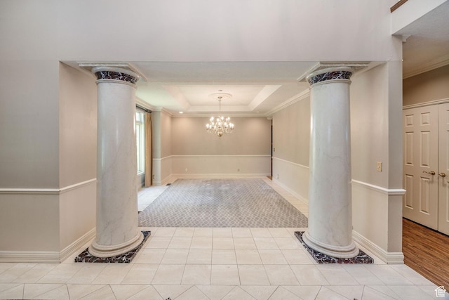 1387 E 260 N, Logan, UT 84321 - foyer entrance featuring decorative columns, ornamental molding, a raised ceiling, and a chandelier