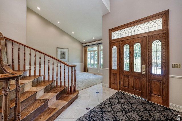 1387 E 260 N, Logan, UT 84321 - entrance foyer featuring high vaulted ceiling, light tile patterned flooring, recessed lighting, light carpet, and stairway