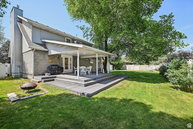537 E Edindrew Cir, Murray, UT 84107 - rear view of property with a fenced backyard, a deck, a chimney, and brick siding
