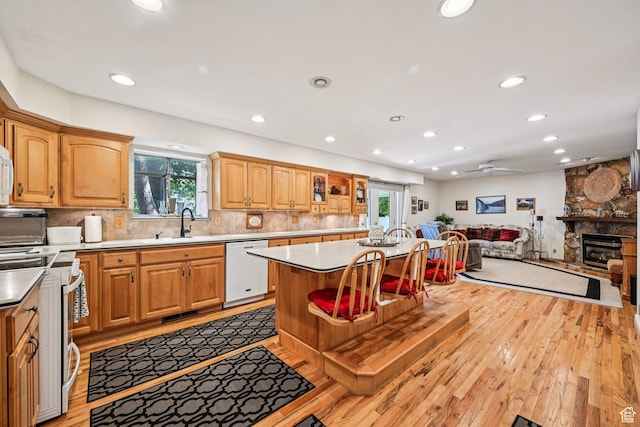 537 E Edindrew Cir, Murray, UT 84107 - kitchen with white dishwasher, range, recessed lighting, light wood-type flooring, and light countertops