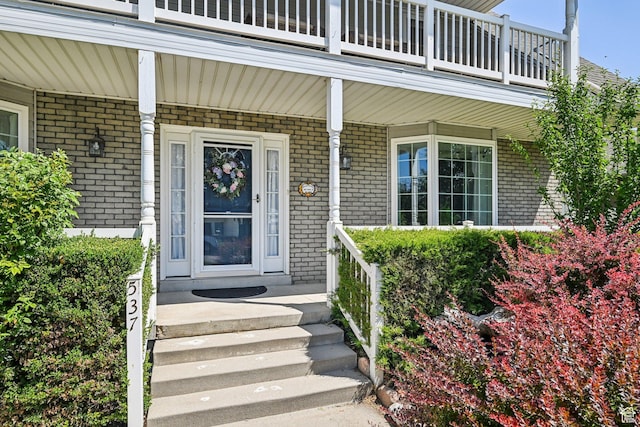 537 E Edindrew Cir, Murray, UT 84107 - property entrance with brick siding, a balcony, and covered porch