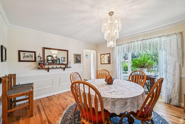 537 E Edindrew Cir, Murray, UT 84107 - dining room featuring a chandelier, wood finished floors, and ornamental molding