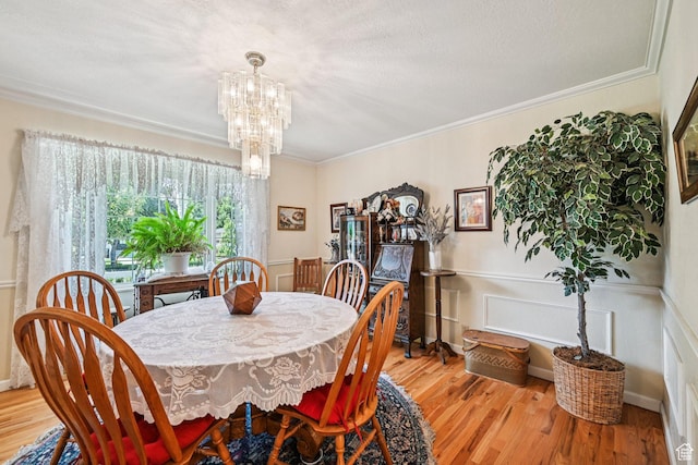 537 E Edindrew Cir, Murray, UT 84107 - dining space with a chandelier, light wood-style floors, and crown molding