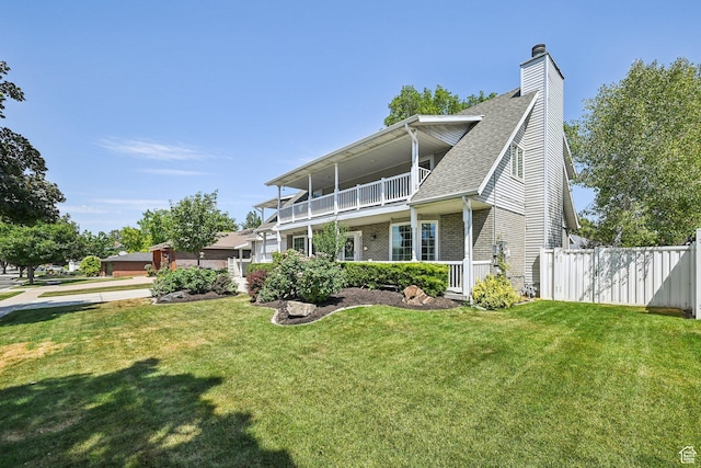 537 E Edindrew Cir, Murray, UT 84107 - view of front facade featuring a chimney, brick siding, a shingled roof, and a balcony