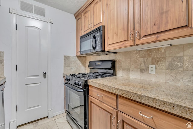 5327 S 560 E Unit F, Murray, UT 84107 - kitchen featuring black appliances, backsplash, and light tile patterned floors