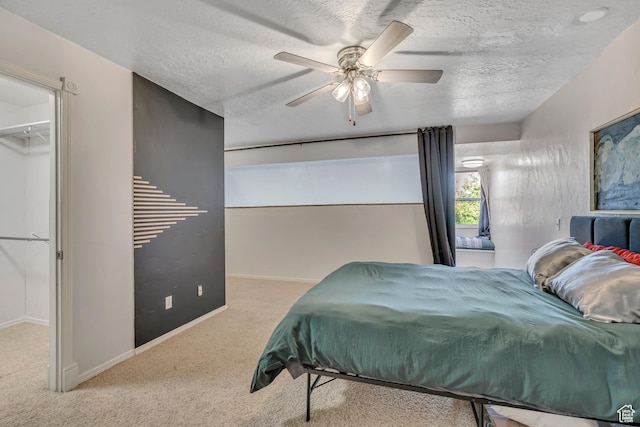 5327 S 560 E Unit F, Murray, UT 84107 - carpeted bedroom featuring ceiling fan, a textured ceiling, and a walk in closet