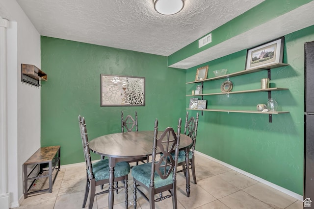5327 S 560 E Unit F, Murray, UT 84107 - dining area featuring a textured ceiling and tile patterned flooring