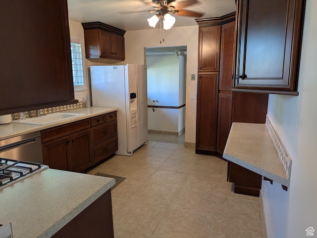 7481 S Castle Hill Cir, Cottonwood Heights, UT 84121 - kitchen featuring white fridge with ice dispenser, ceiling fan, light countertops, light tile patterned floors, and stainless steel dishwasher