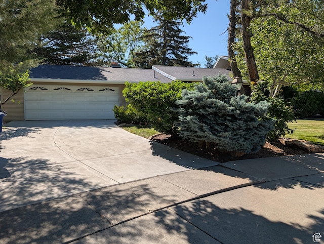 7481 S Castle Hill Cir, Cottonwood Heights, UT 84121 - view of front of house featuring driveway and a garage