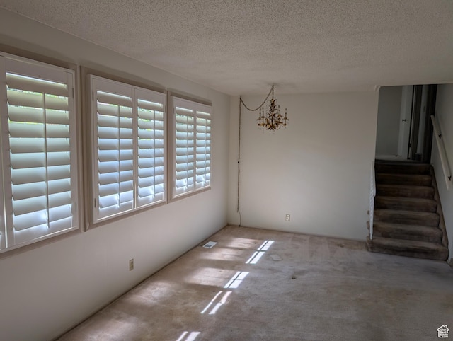 7481 S Castle Hill Cir, Cottonwood Heights, UT 84121 - unfurnished dining area with carpet floors, a textured ceiling, stairway, and a chandelier