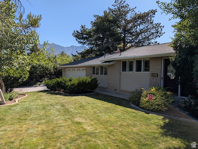 7481 S Castle Hill Cir, Cottonwood Heights, UT 84121 - view of side of property with a garage, brick siding, a lawn, and a mountain view