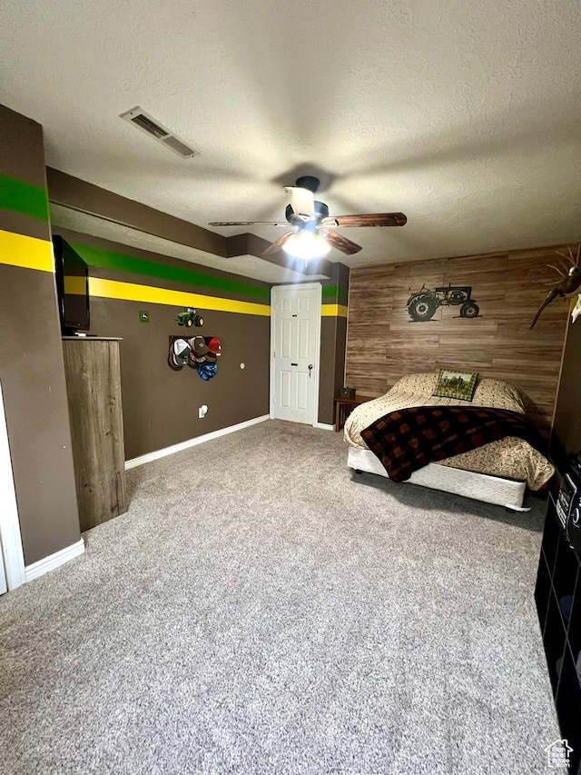 80 N 200 W, Central Valley, UT 84754 - bedroom featuring a textured ceiling, carpet flooring, wooden walls, and ceiling fan