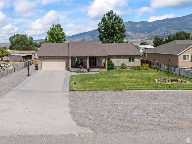 80 N 200 W, Central Valley, UT 84754 - single story home featuring an attached garage, a mountain view, concrete driveway, and brick siding