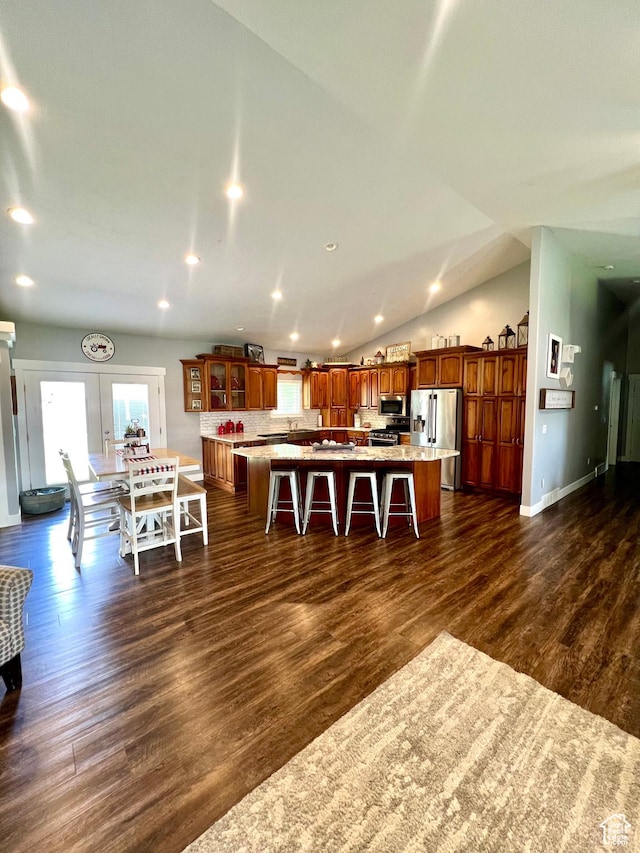 80 N 200 W, Central Valley, UT 84754 - kitchen featuring stainless steel appliances, a breakfast bar area, brown cabinets, dark wood-type flooring, and recessed lighting