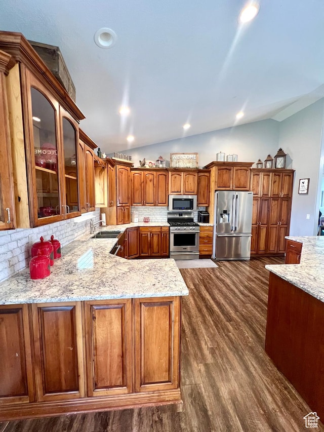 80 N 200 W, Central Valley, UT 84754 - kitchen with stainless steel appliances, vaulted ceiling, backsplash, light stone counters, and dark wood-style floors