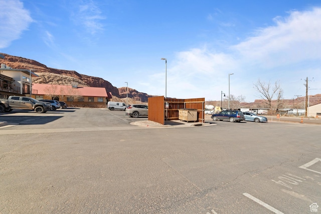 443 Kane Creek Blvd Unit 212, Moab, UT 84532 - uncovered parking lot featuring a mountain view