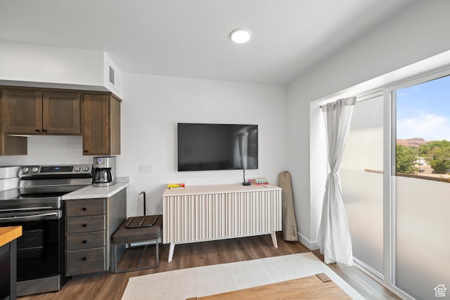 443 Kane Creek Blvd Unit 212, Moab, UT 84532 - kitchen with stainless steel electric stove, wood finished floors, dark brown cabinets, light countertops, and recessed lighting