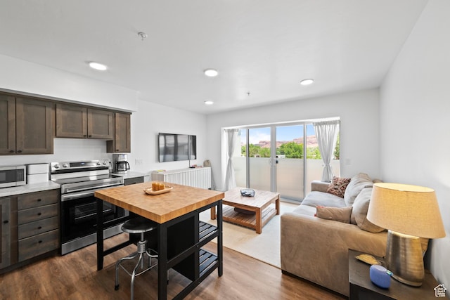 443 Kane Creek Blvd Unit 212, Moab, UT 84532 - kitchen featuring appliances with stainless steel finishes, dark brown cabinets, dark wood-style flooring, light countertops, and recessed lighting