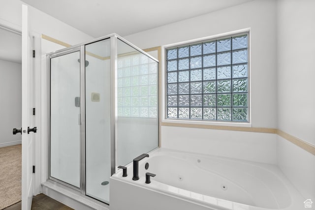 713 S 600 E, Layton, UT 84041 - full bath with a stall shower, healthy amount of natural light, and a jetted tub