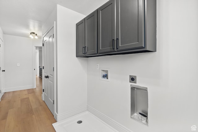 713 S 600 E, Layton, UT 84041 - laundry area featuring hookup for an electric dryer, washer hookup, cabinet space, and light wood-style floors