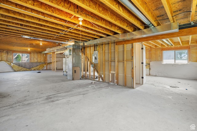 713 S 600 E, Layton, UT 84041 - below grade area with electric panel, plenty of natural light, and heating unit