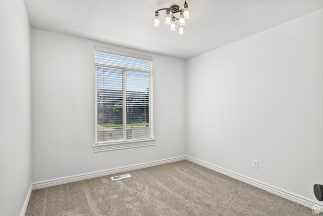 713 S 600 E, Layton, UT 84041 - spare room featuring a chandelier and carpet floors