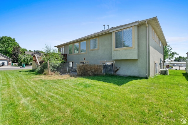 713 S 600 E, Layton, UT 84041 - rear view of house featuring stucco siding and a yard