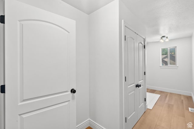 713 S 600 E, Layton, UT 84041 - corridor with light wood-style floors and a textured ceiling